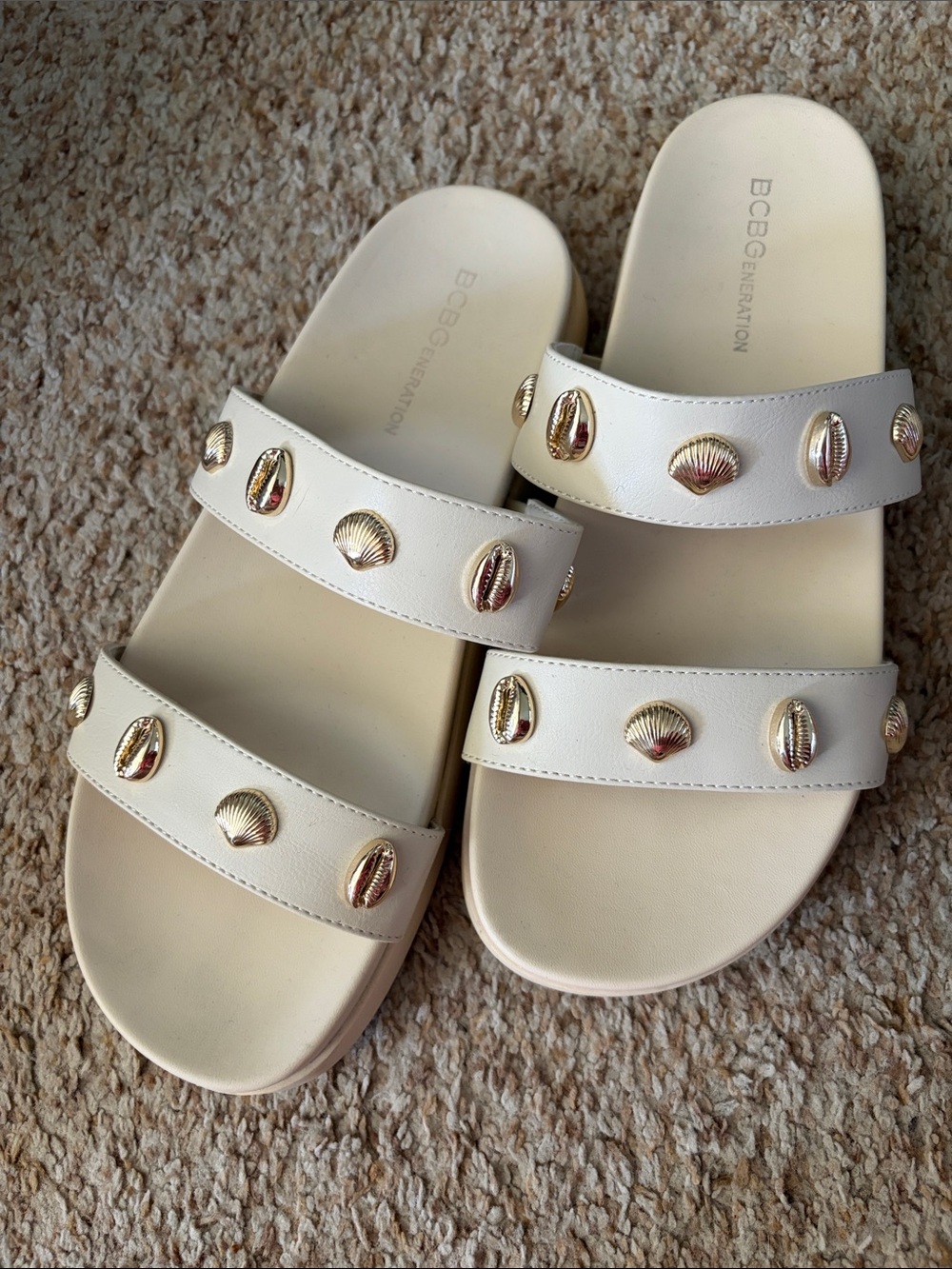 BCBGeneration Cream Slide Sandals with Gold Shell Accents